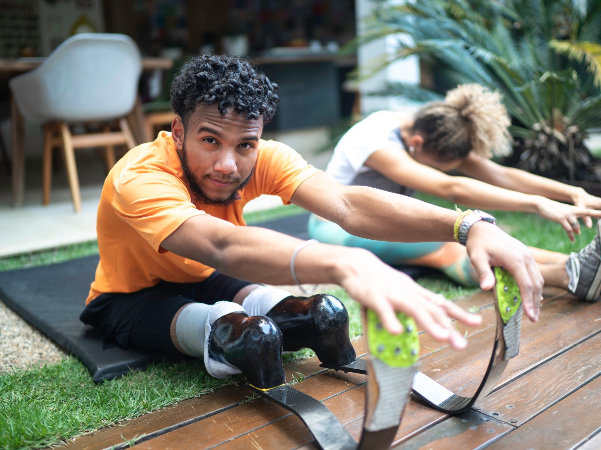 https://www.agedcareguide.com.au/assets/news/articles/portrait-of-young-man-with-prosthetic-leg-stretching-in-the-yard-picture-id1181317568.jpg