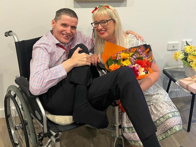 David Cunningham is happy to be living in new Specialist Disability Accommodation and was welcomed home by Michaela Brown, Group Chief Operating Office of Home Caring. [Supplied: Home Caring]