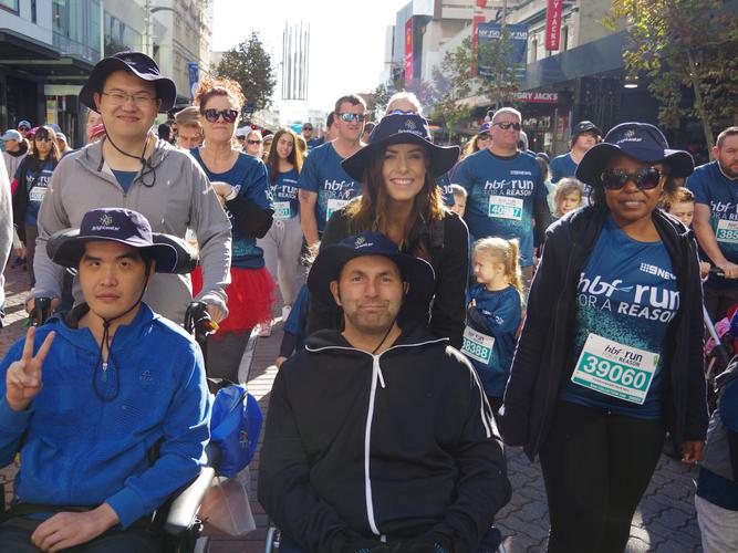 Elysia Connor (centre) with residents from Brightwater​ Oats Street Brain Injury Rehabilitation Centre undertaking this years HBF Run For a Reason. [Source: Brightwater]