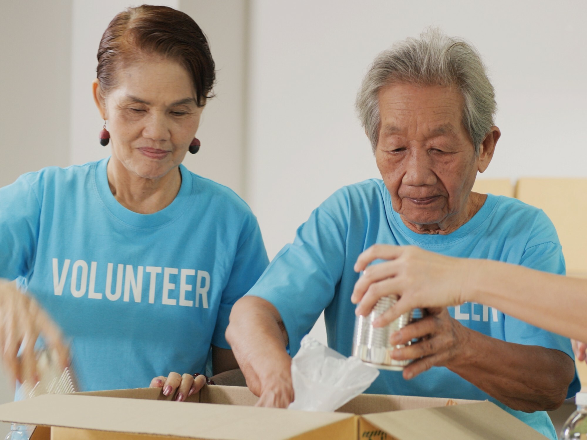 Older ladies volunteering at a charity