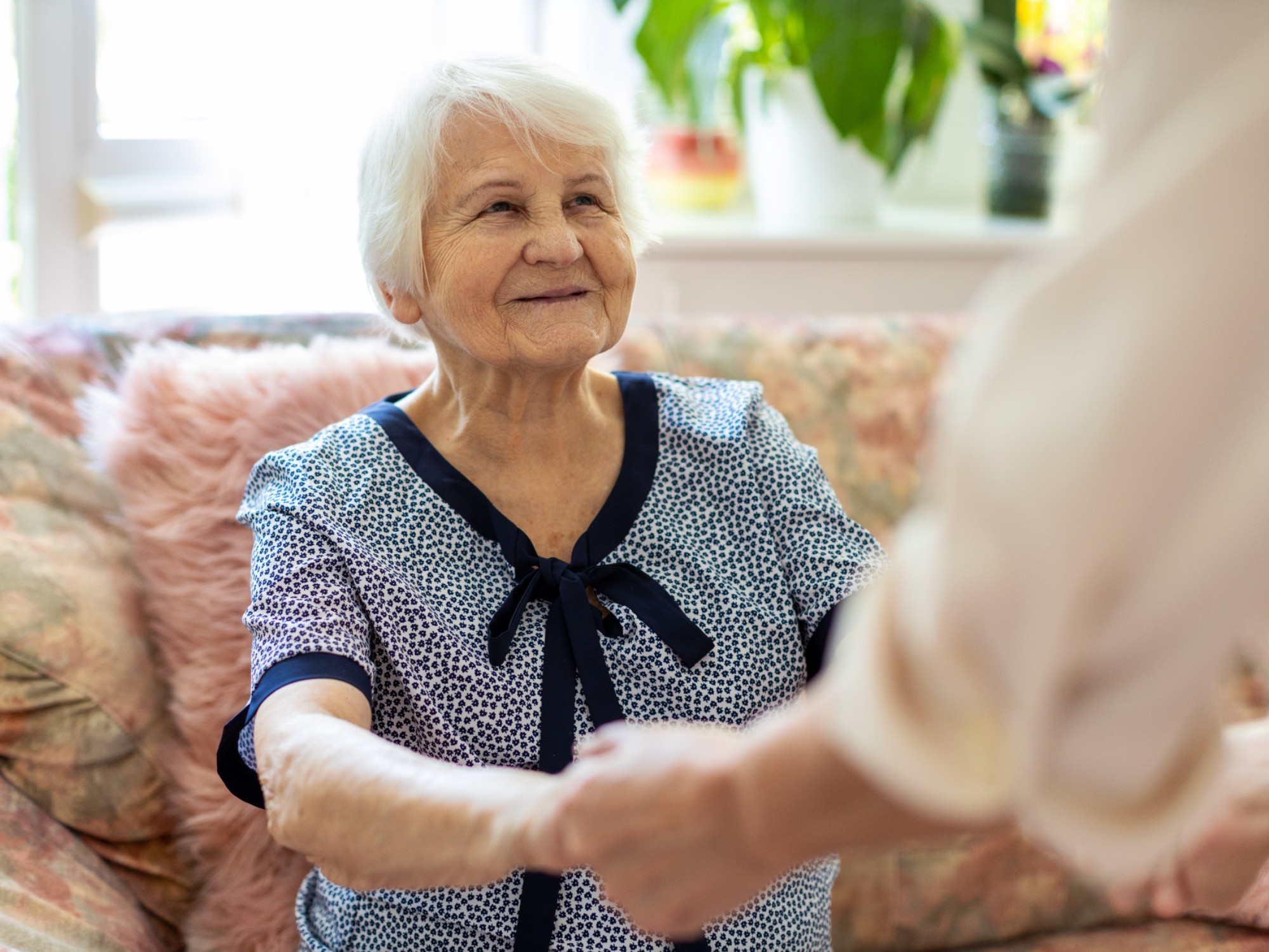 Older woman receiving help at home
