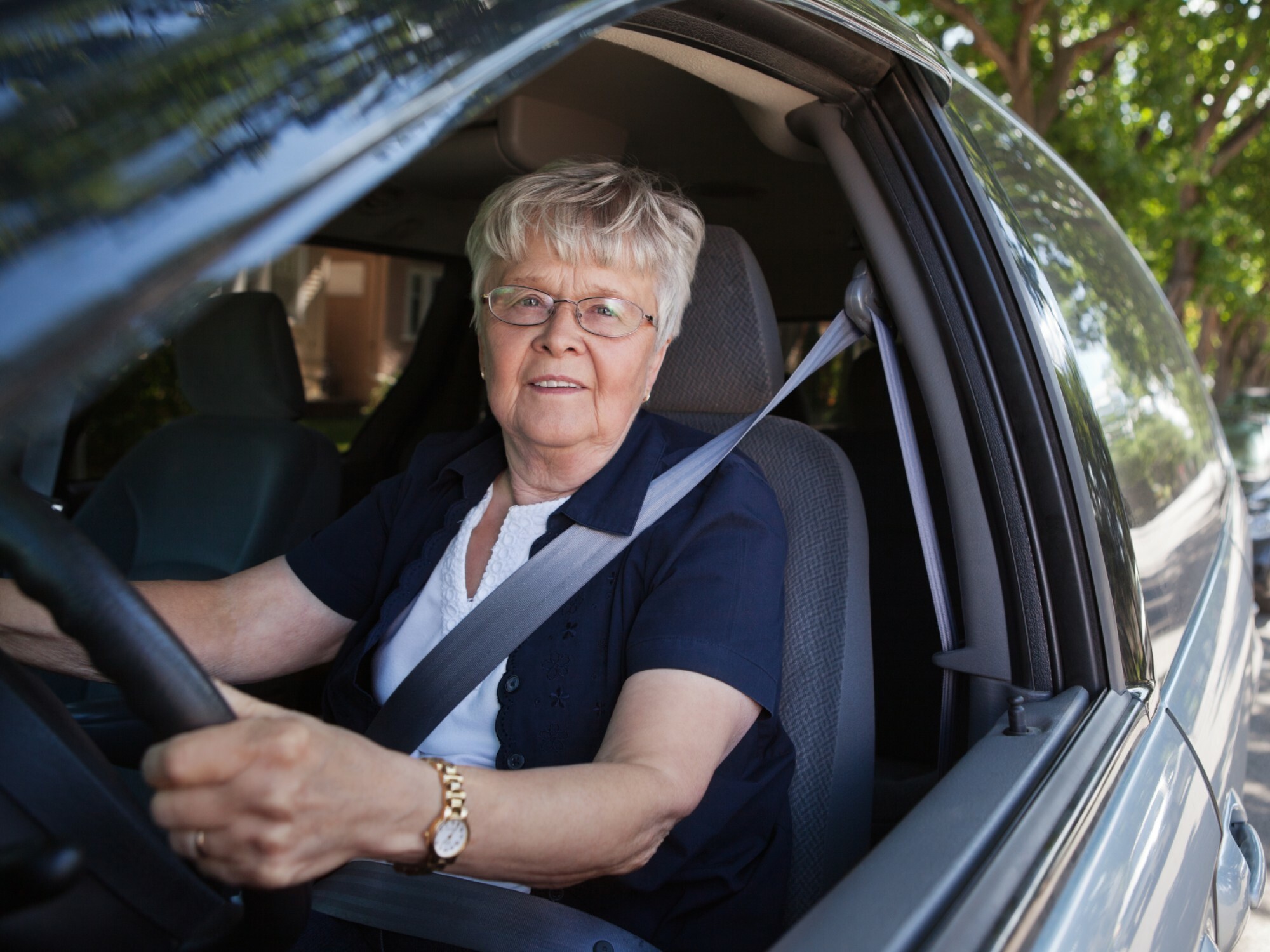 Older person driving a car