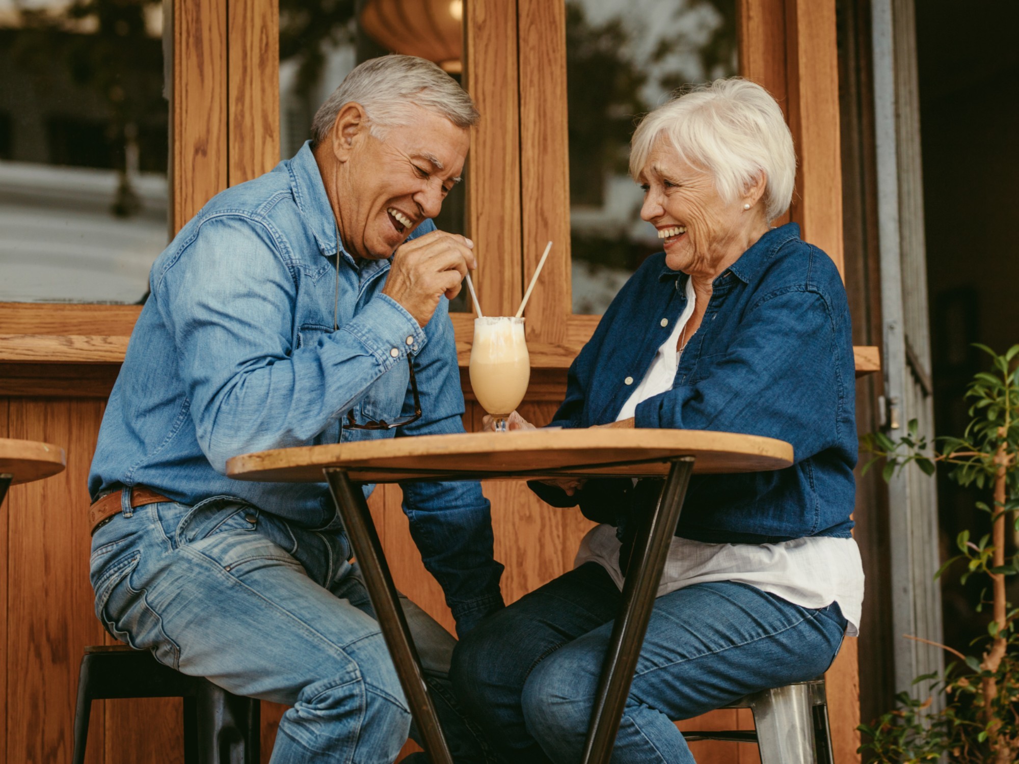 Older couple enjoying a milkshake together