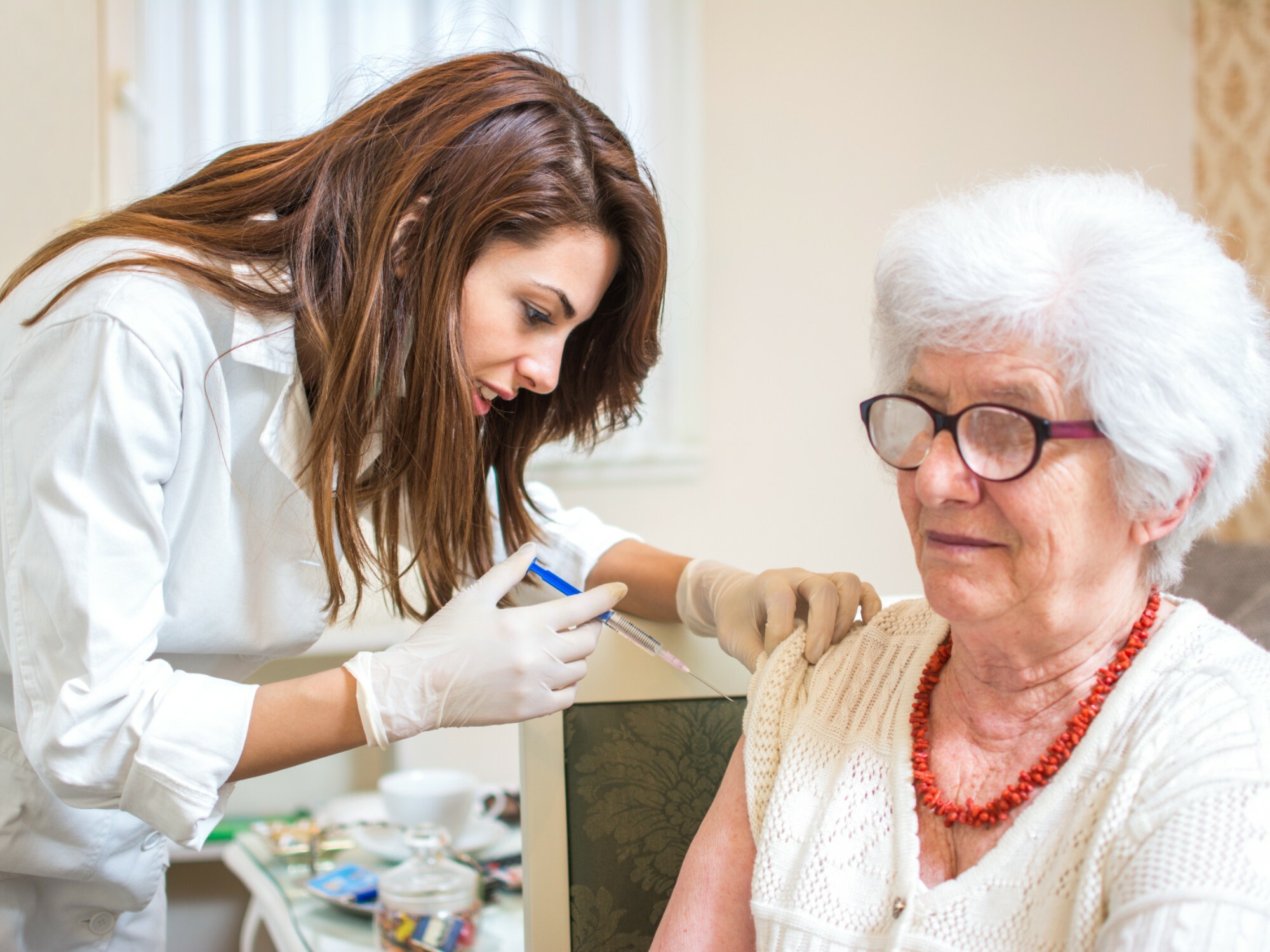 Older woman getting vaccinated.