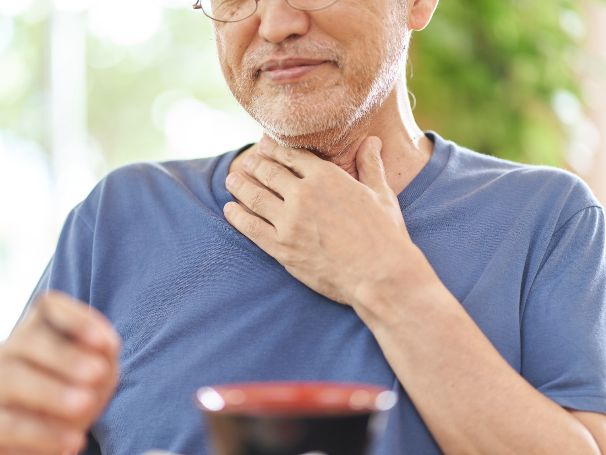 Older person experiencing dysphagia