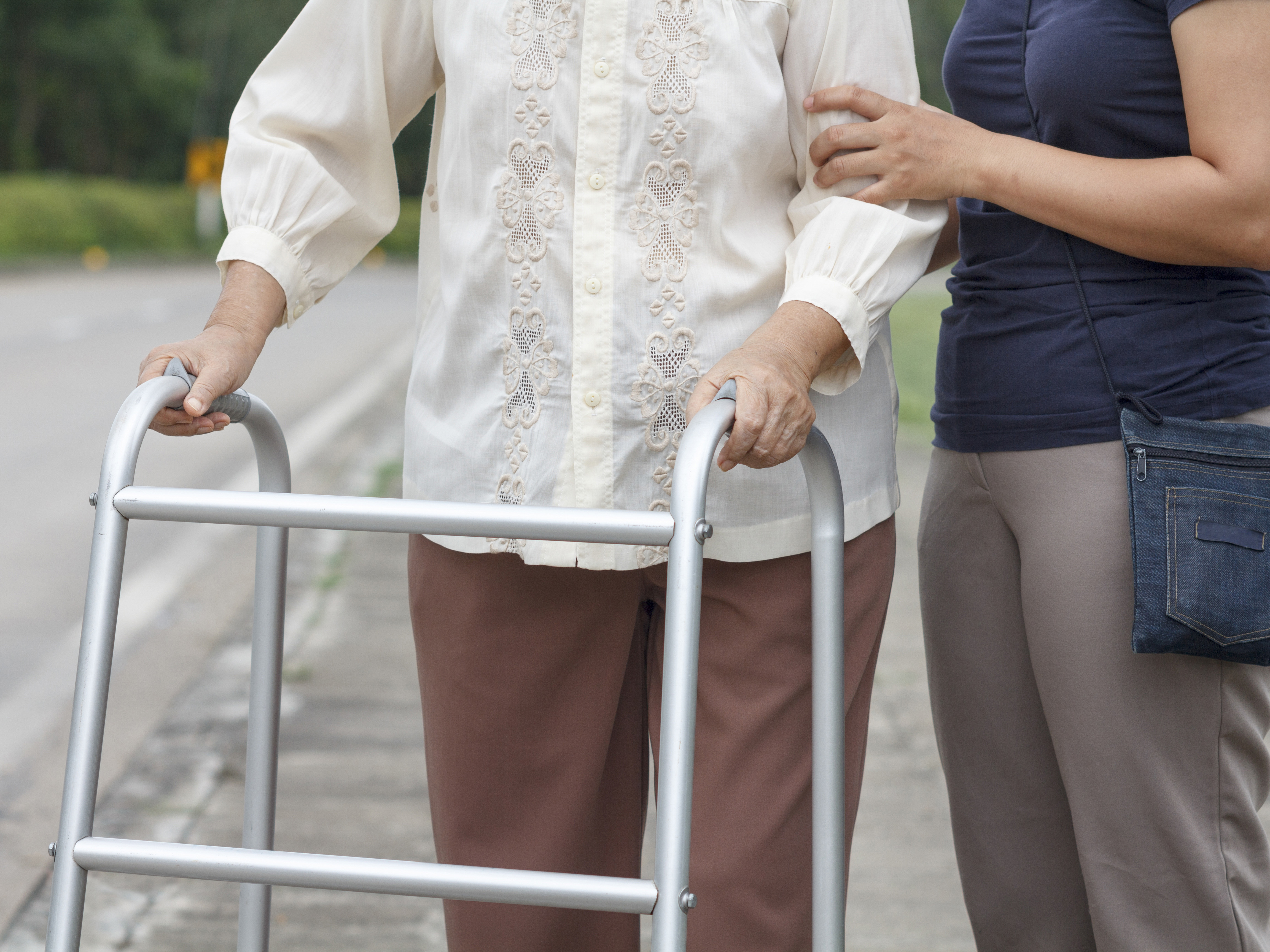 Older woman with a mobility aid.