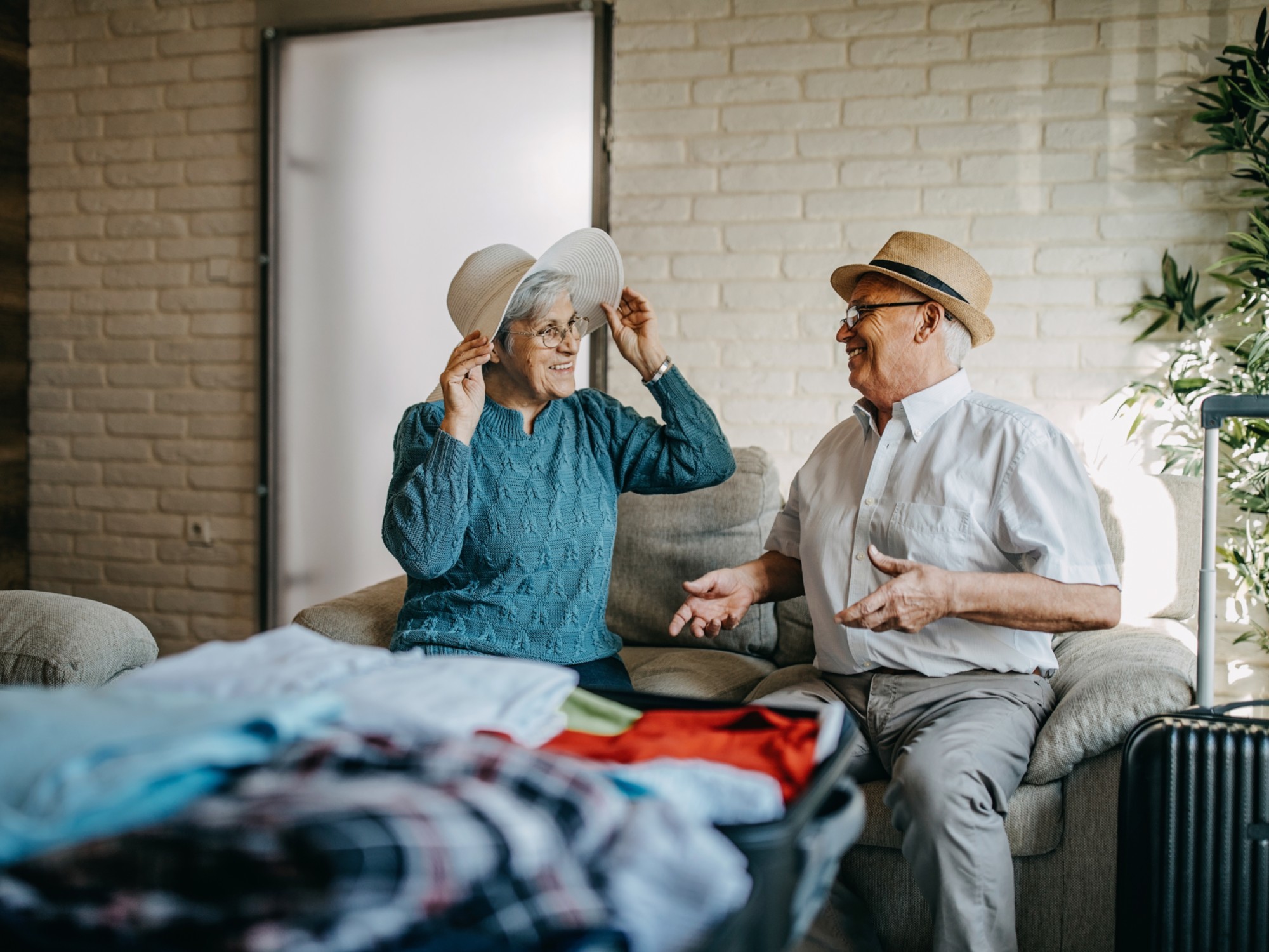 Older couple packing for a vacation