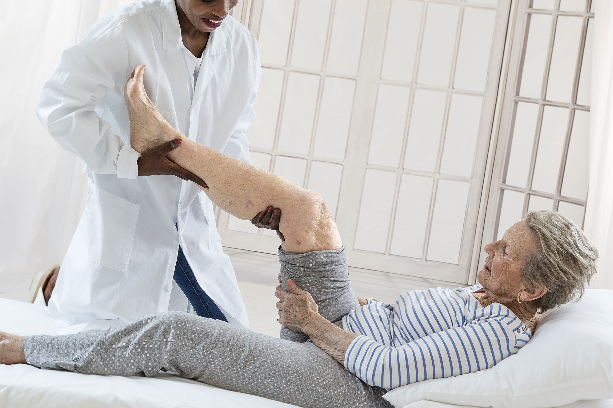 Older woman receiving physiotherapy at a Day Therapy Centre